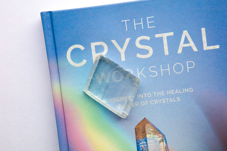 Rhomboid calcites exhibit an optical phenomenon called birefringence, where light entering the crystal is refracted twice, causing a double image when placed on a surface.