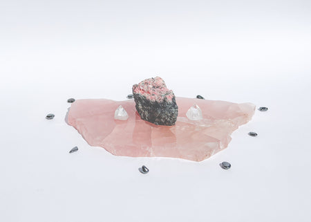 Rose quartz slab #2 used as a foundation stone in a crystal grid.
